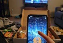 Free Puzzle Games That Are Actually Worth Playing Phone on pizza box, Cheeto-dusted thumb on puzzle game.